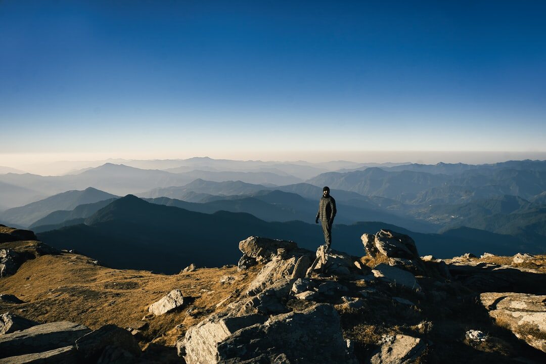 confident person on mountain peak