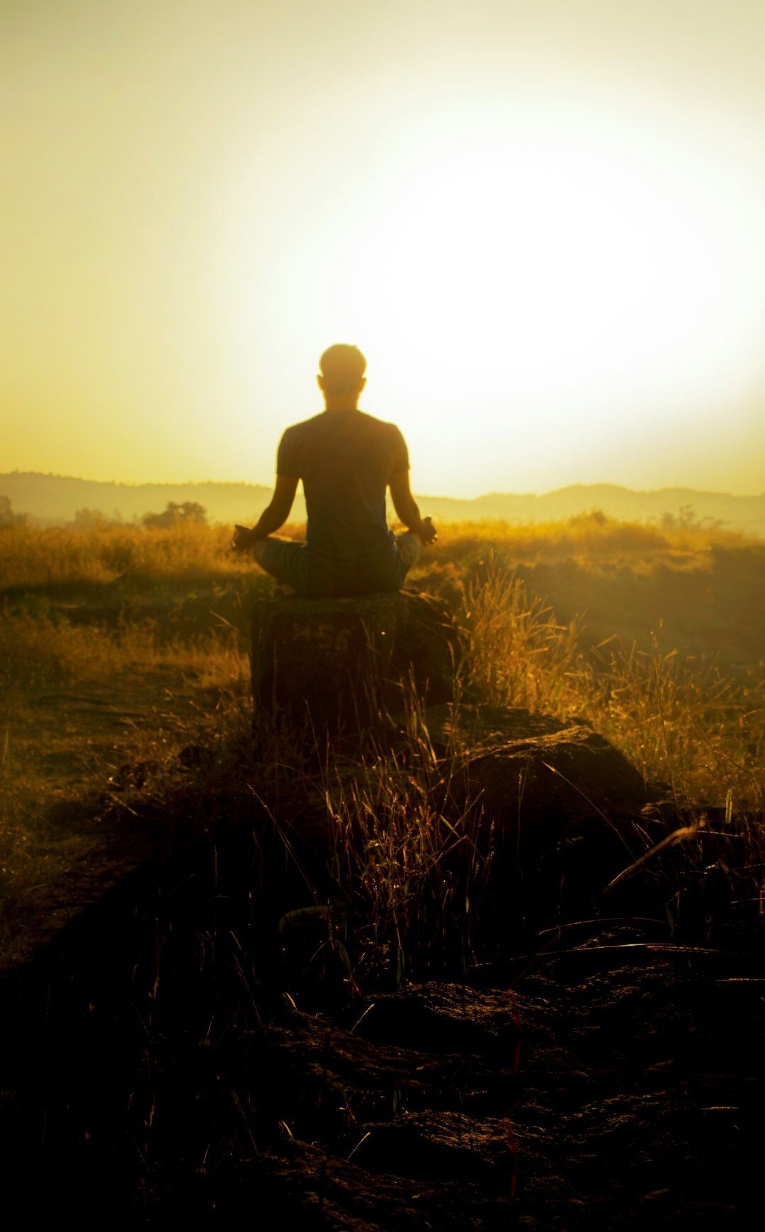 person meditating in morning light